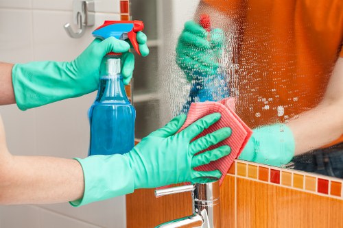 Cleaner carrying out a risk assessment before starting work