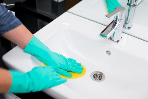 Professional cleaner reviewing service scope at a property